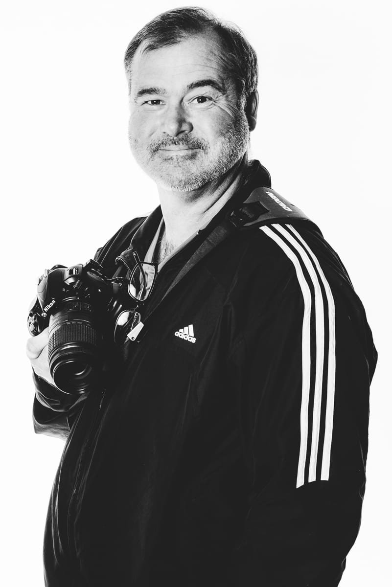 Professional headshot demonstrating proper posing technique and lighting for business portraits