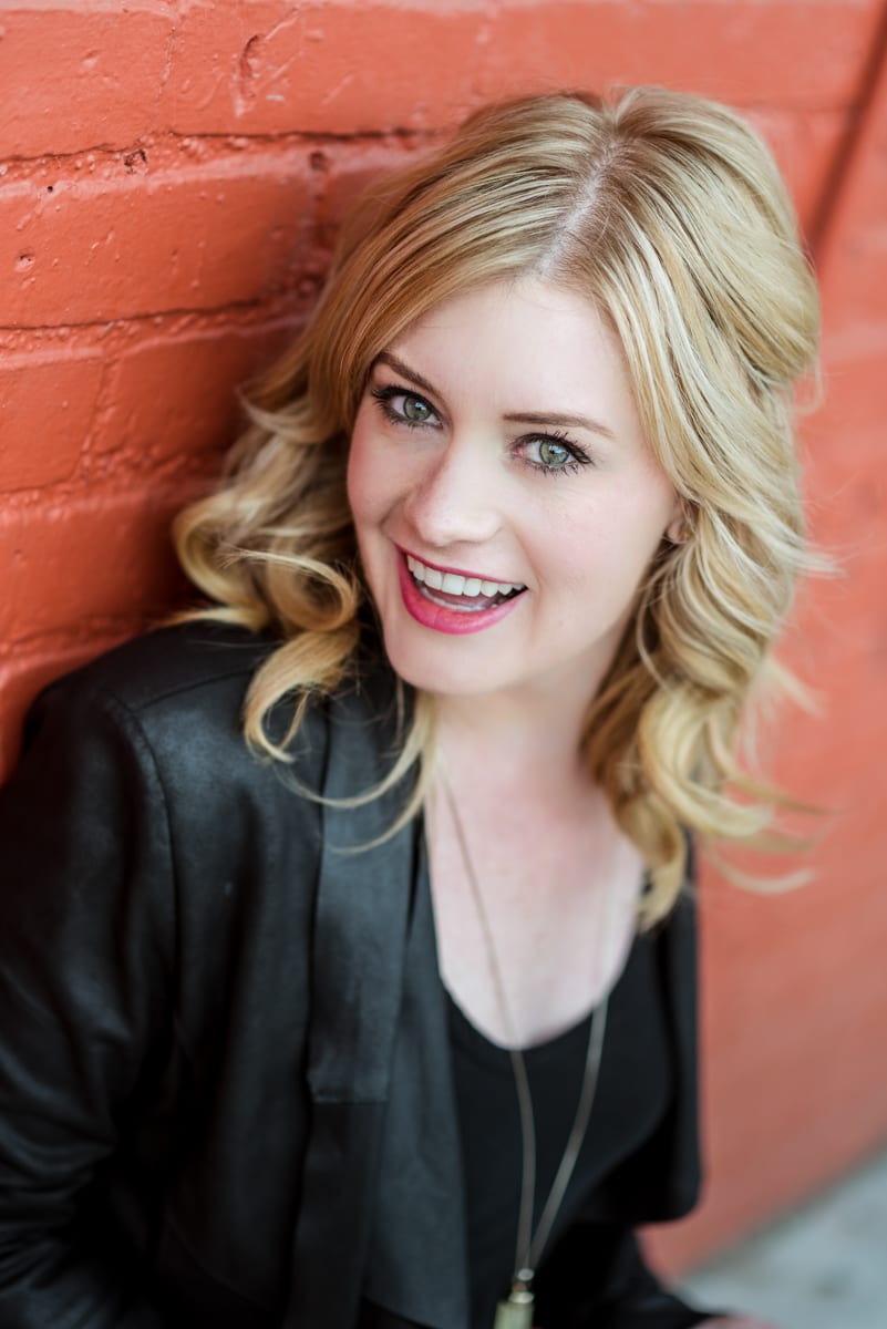 Professional headshot showing authentic expression and comfortable demeanor