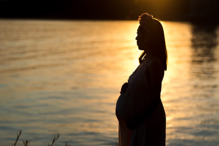 Denver maternity photographer captures glowing expectant mother outdoors
