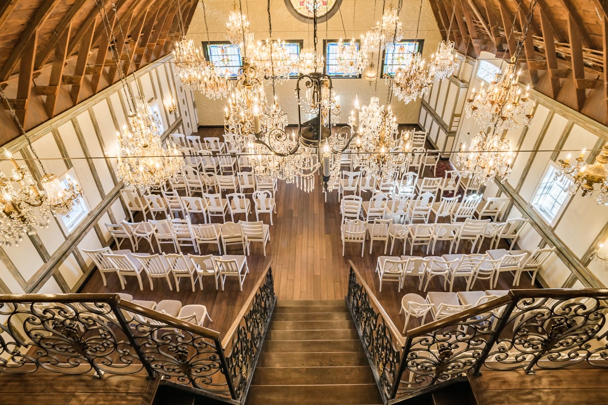 Elegant crystal chandeliers hanging in the Chandelier Barn at Lionsgate Event Center, creating a glamorous atmosphere for wedding ceremonies