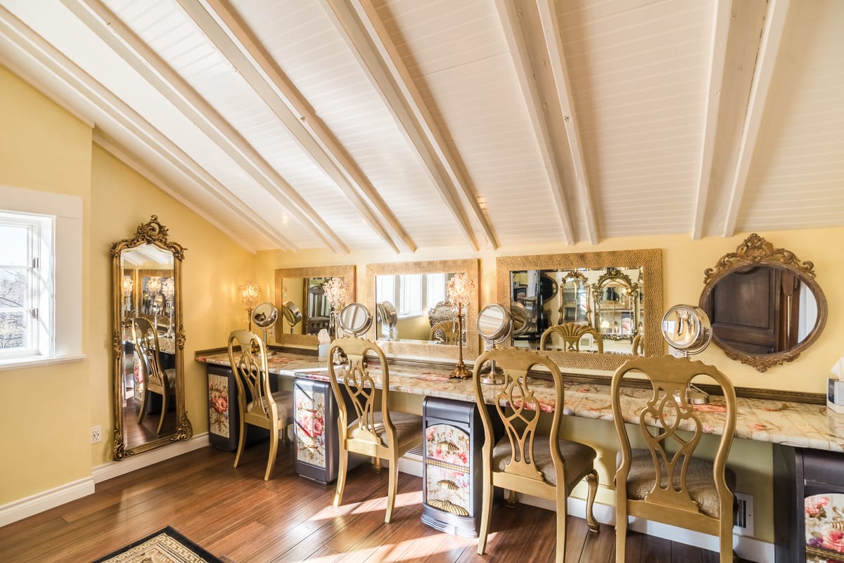 Interior reception space of Chandelier Barn showing elegant chandeliers, white walls, and sophisticated lighting