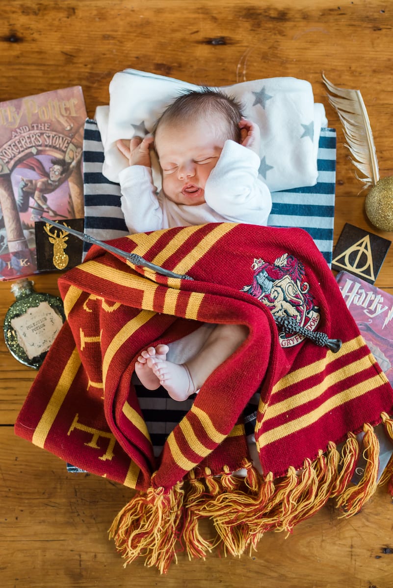 newborn amongst harry potter memorabilia 