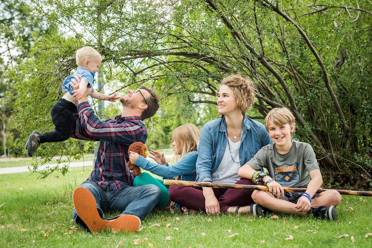Dad holds up baby | Family Photography | From the Hip Photo