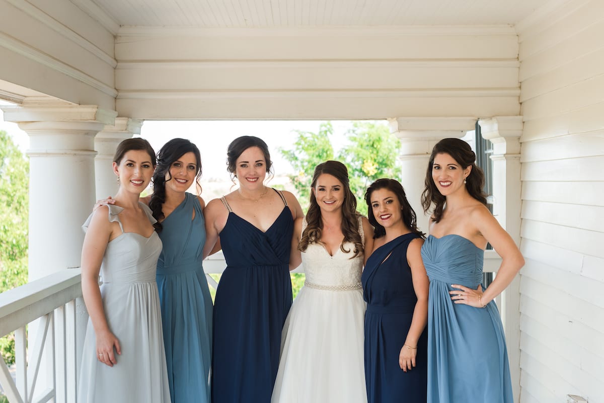 Bride and groom exchange vows with Willow Ridge Manor mountain backdrop during ceremony
