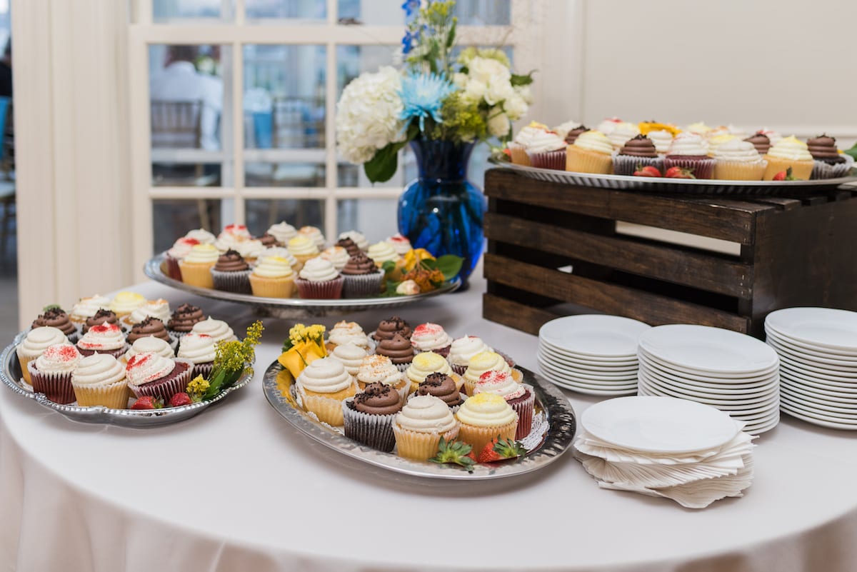 Bride and groom dance together with mountain sunset illuminating Willow Ridge Manor reception