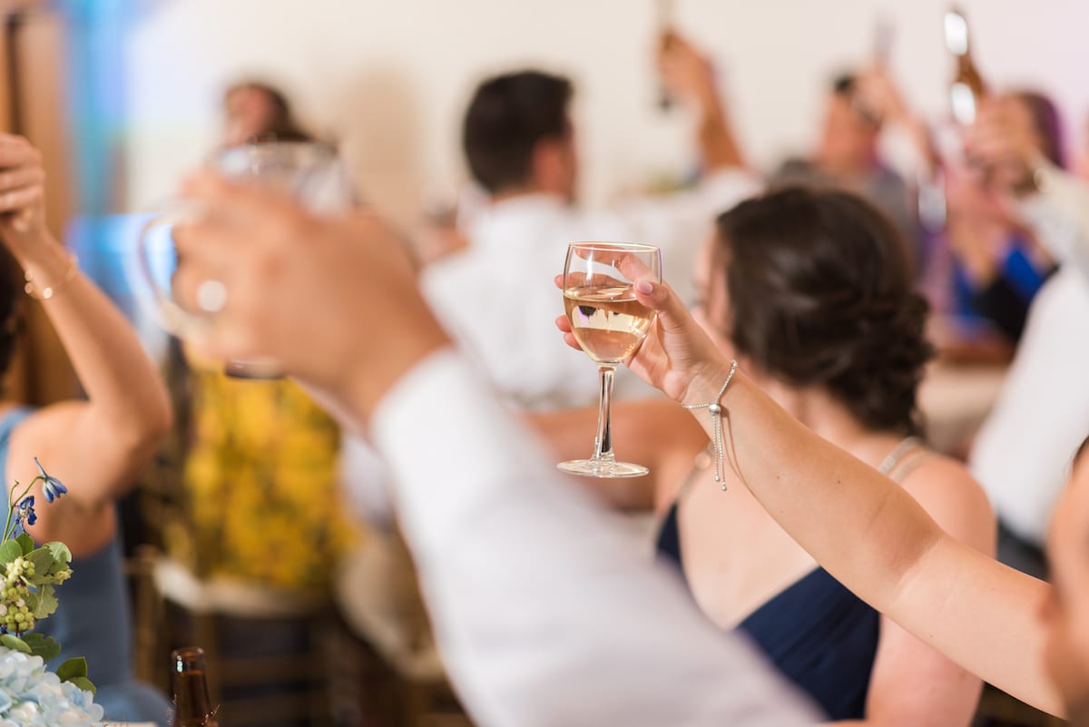 Evening celebration at Willow Ridge Manor with bride and groom surrounded by mountain landscape