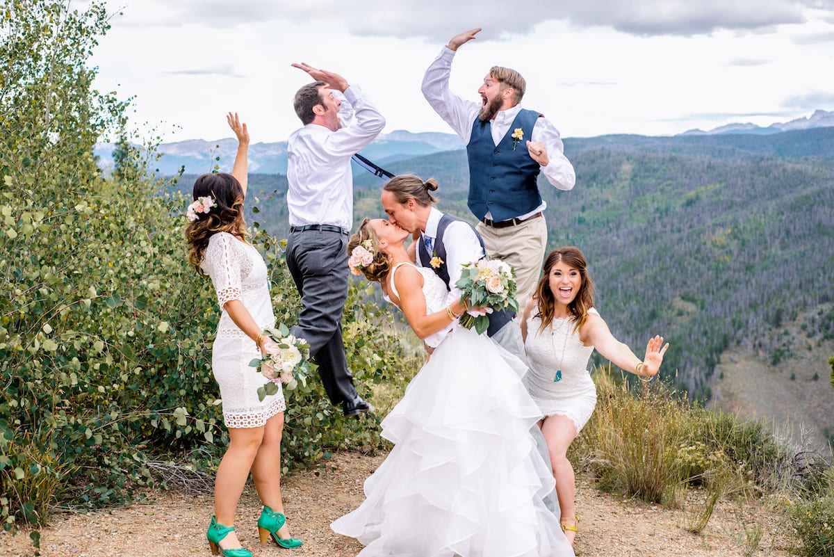 Outdoor wedding celebration with mountain landscape at Granby Ranch