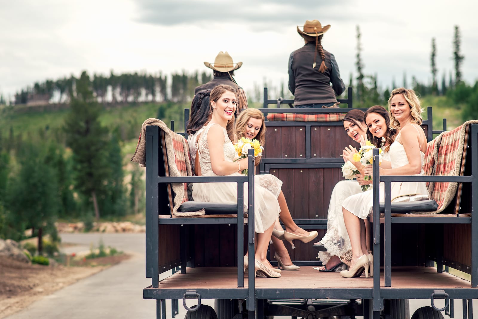 Outdoor wedding ceremony at Devil's Thumb Ranch with guests seated under a summer sky