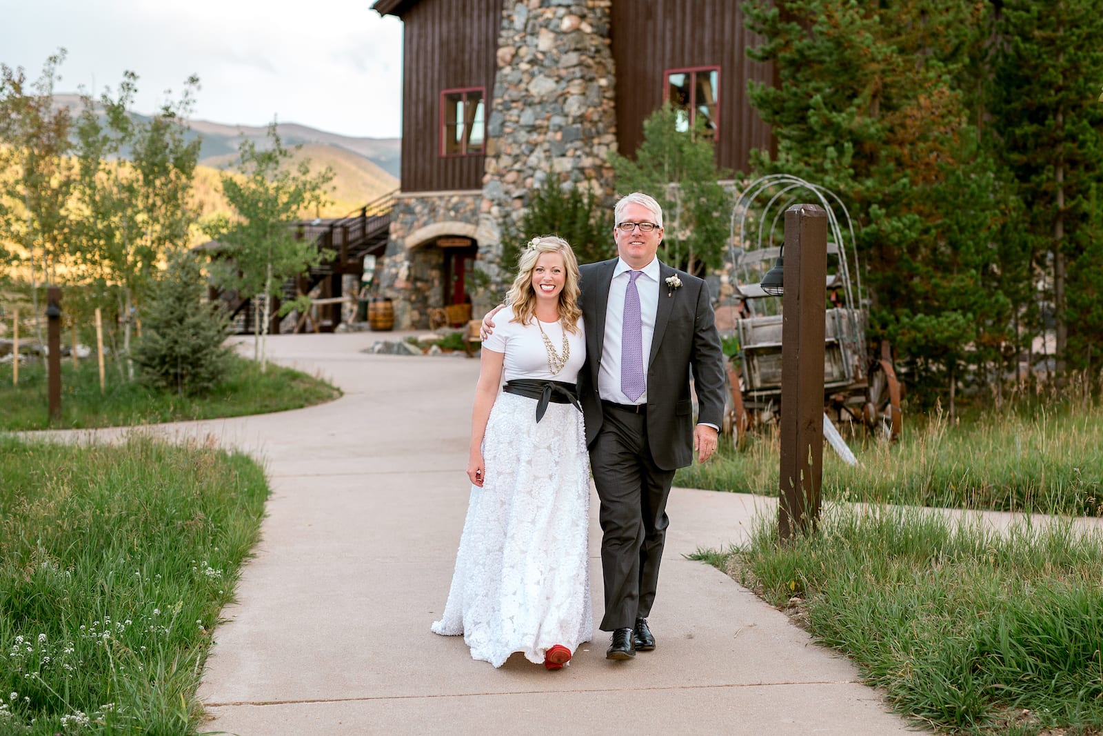 Romantic sunset portrait of newlyweds with the Continental Divide behind them at Devil's Thumb Ranch