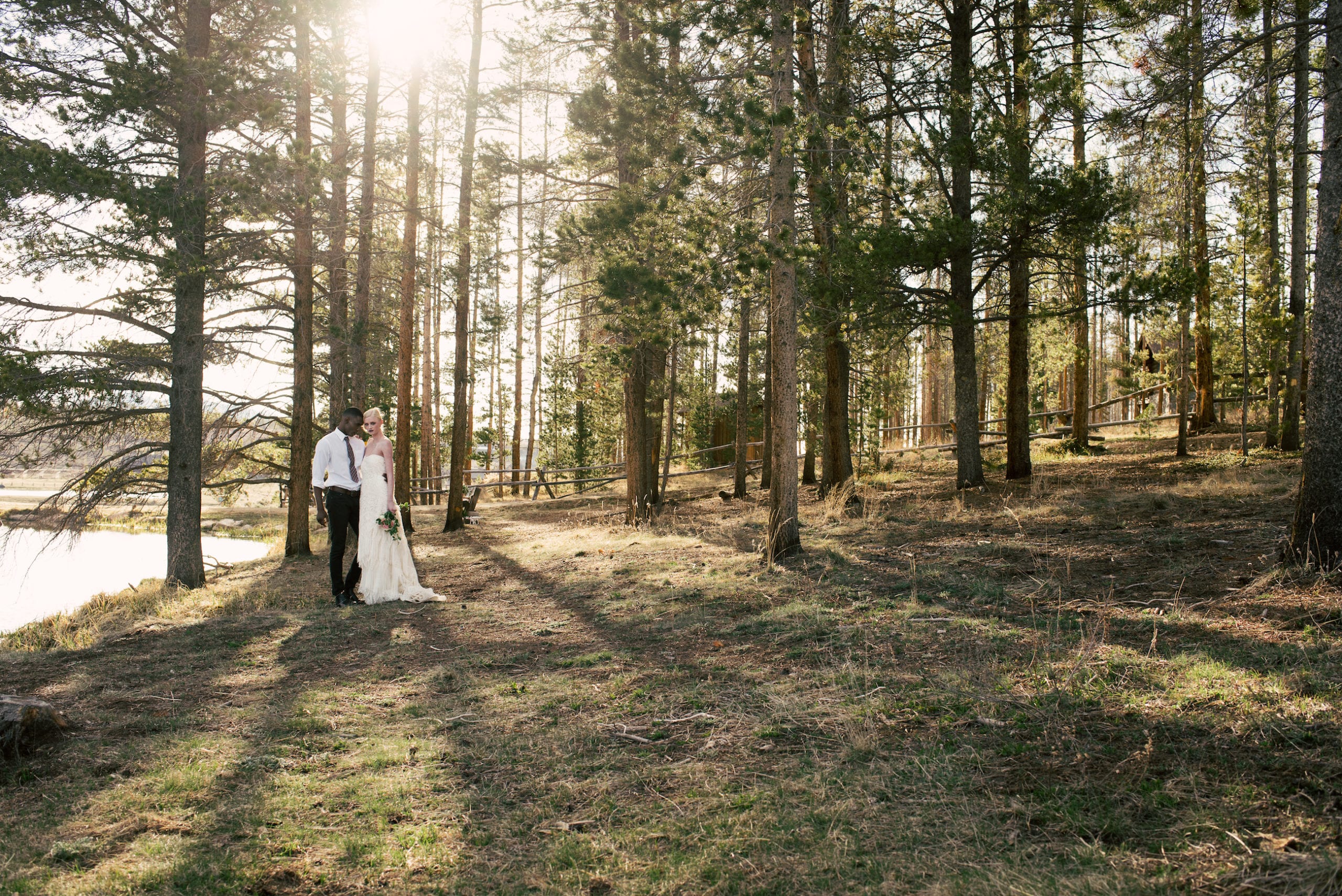 Elegant table setting and floral centerpiece inside a Devil's Thumb Ranch wedding reception space