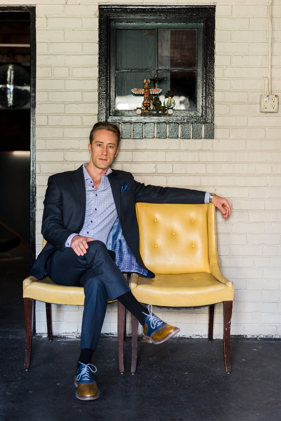 Professional headshot of man in business casual attire with warm, professional demeanor