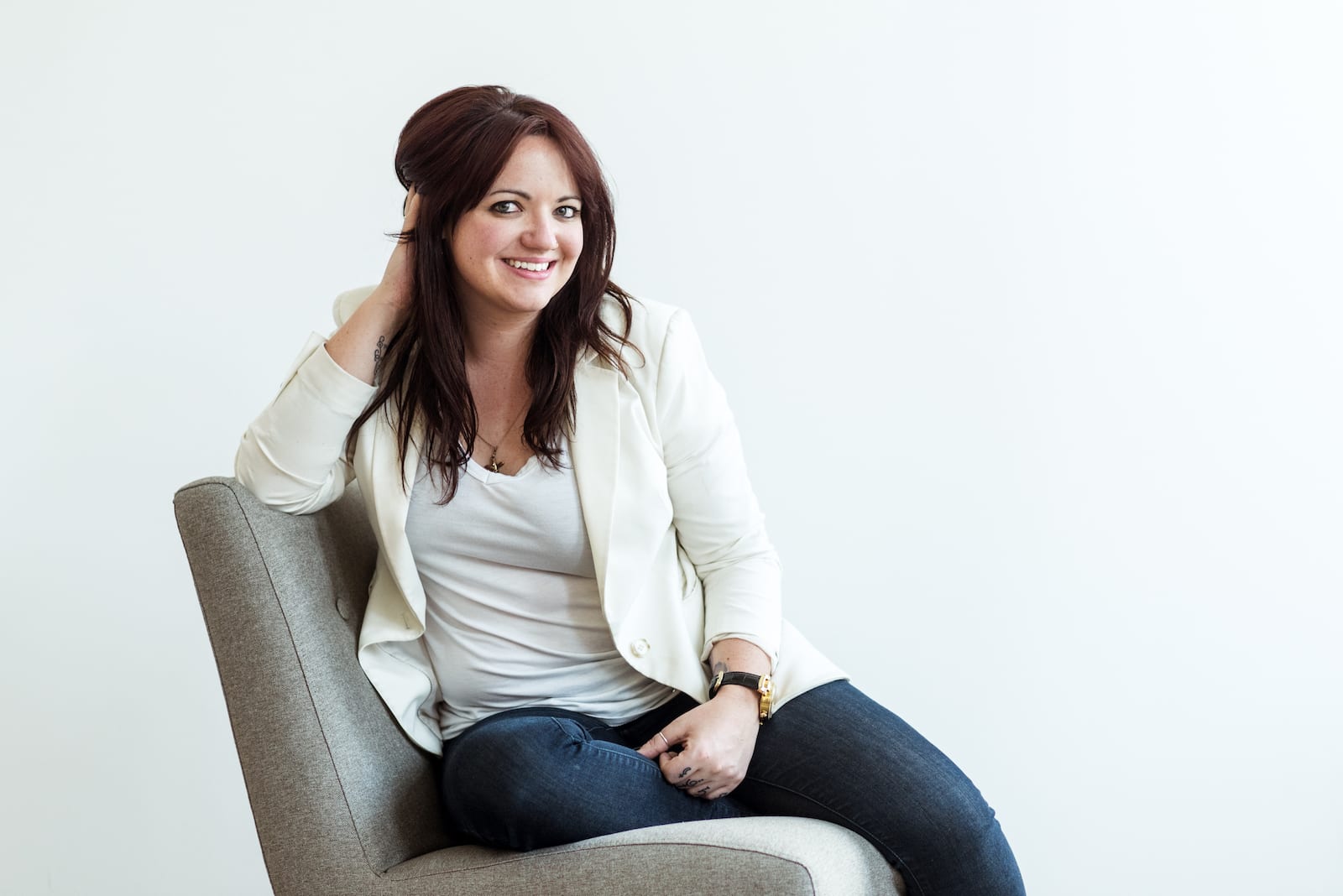 Professional business headshot with confident posture and engaging eye contact