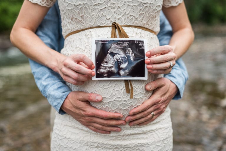 Intimate maternity photography session celebrating baby bump in Denver