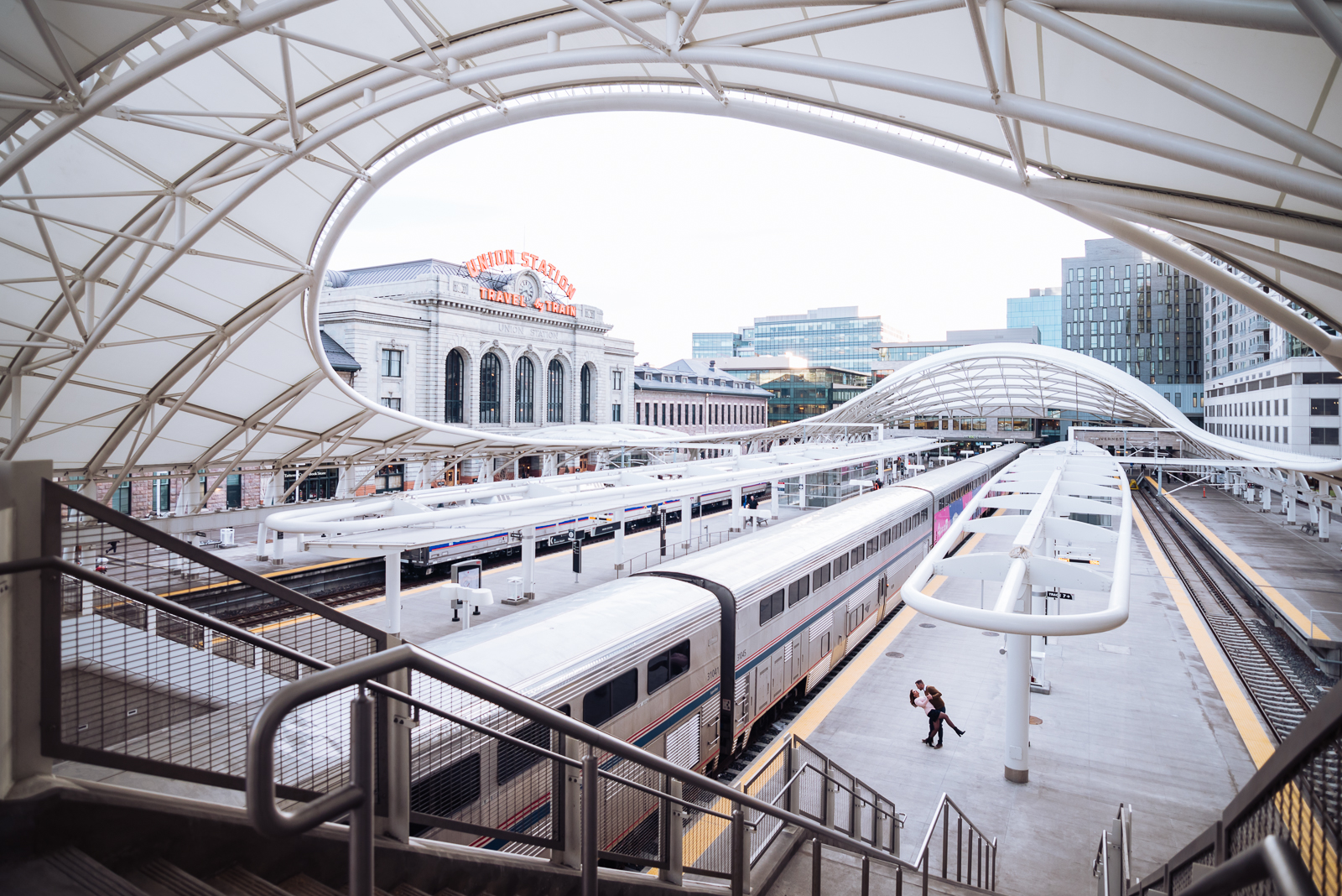 The Quintessential Denver Engagement | Engagement Photo | Union Station Millennium Bridge | From the Hip Photo