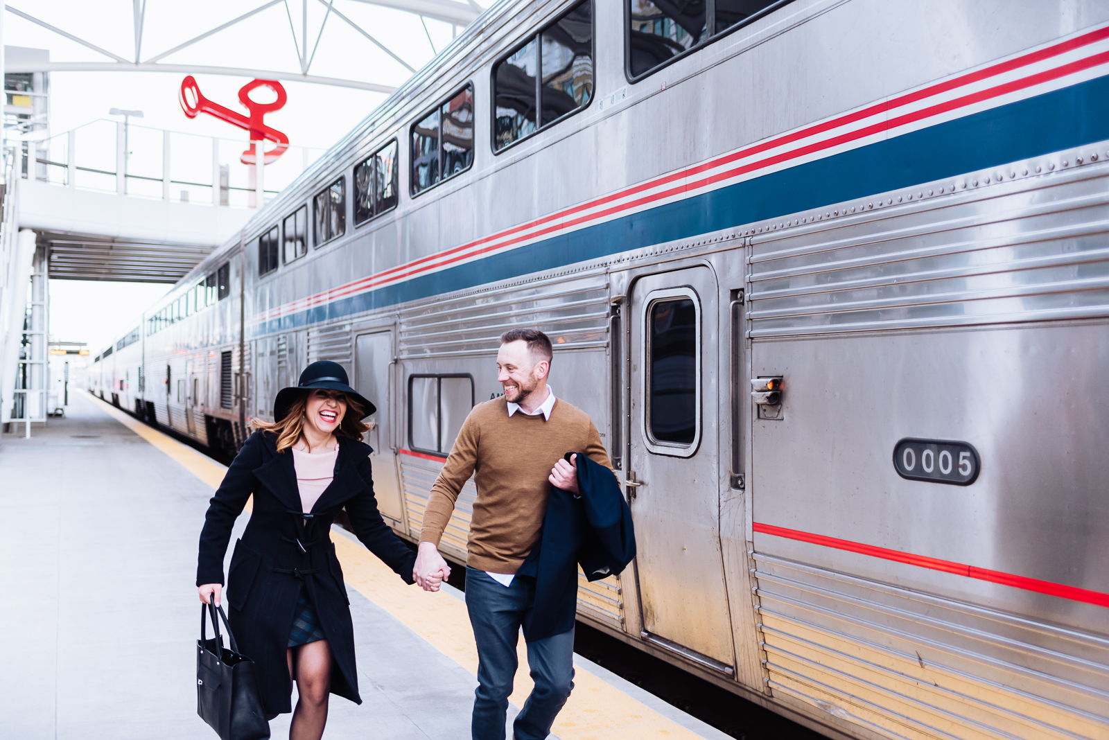 The Quintessential Denver Engagement | Engagement Photo | Union Station Millennium Bridge | From the Hip Photo