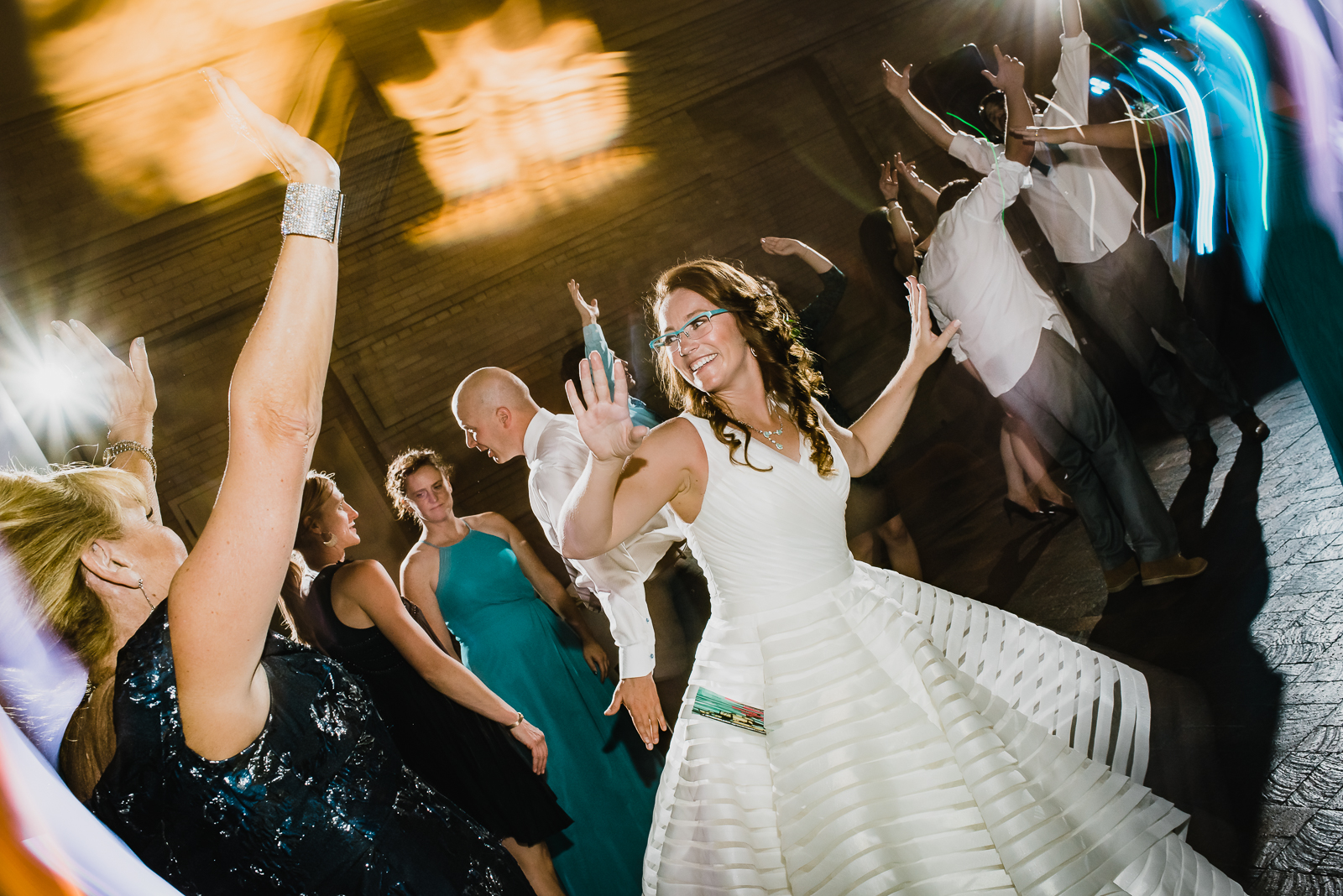 Guests dancing at Denver Museum of Nature and Science wedding celebration