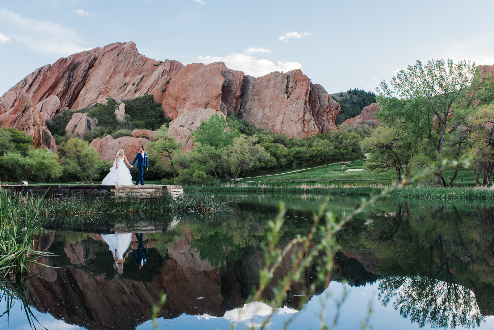 Newlyweds celebrating at Arrowhead Golf Course wedding