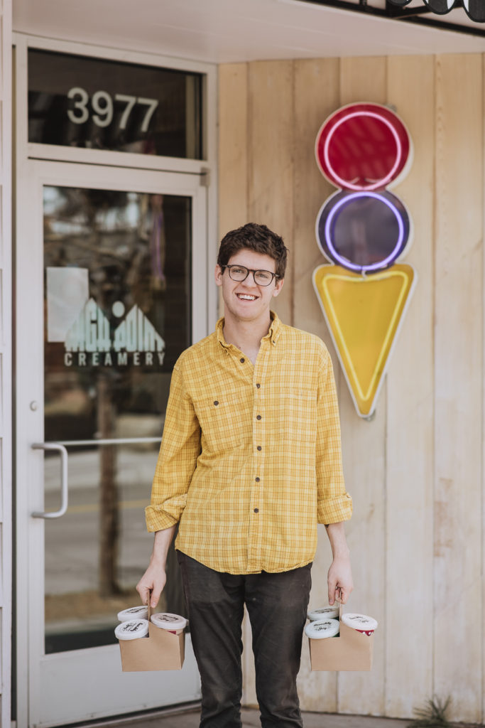 Product Photography | Man stands by front door and neon ice cream cone shaped sign | High Point Creamery, Denver, Colorado