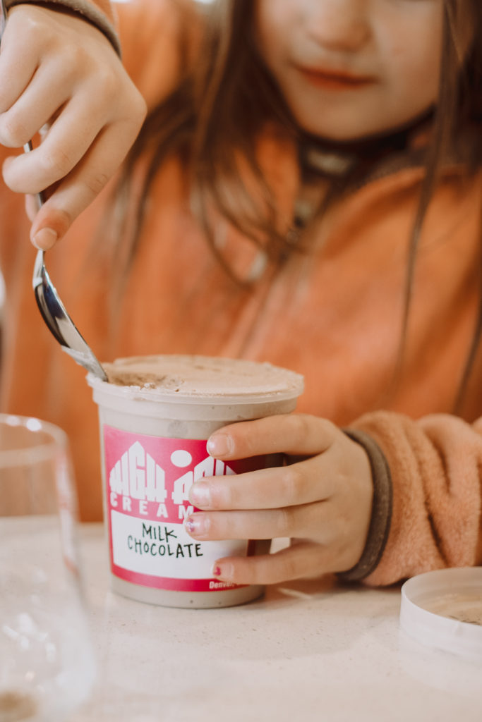 Product Photography | Girl scoops out milk chocolate from ice cream from pint cup | High Point Creamery, Denver, Colorado