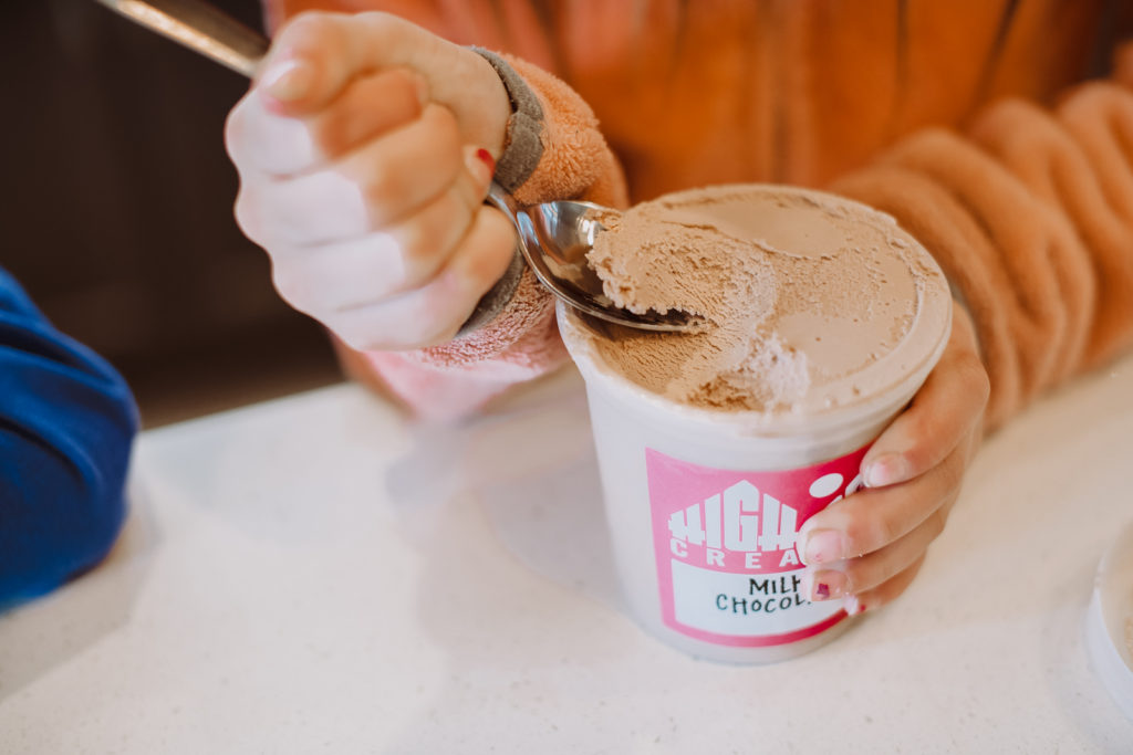Product Photography | Close up on hand scooping ice cream from pint cup | High Point Creamery, Denver, Colorado