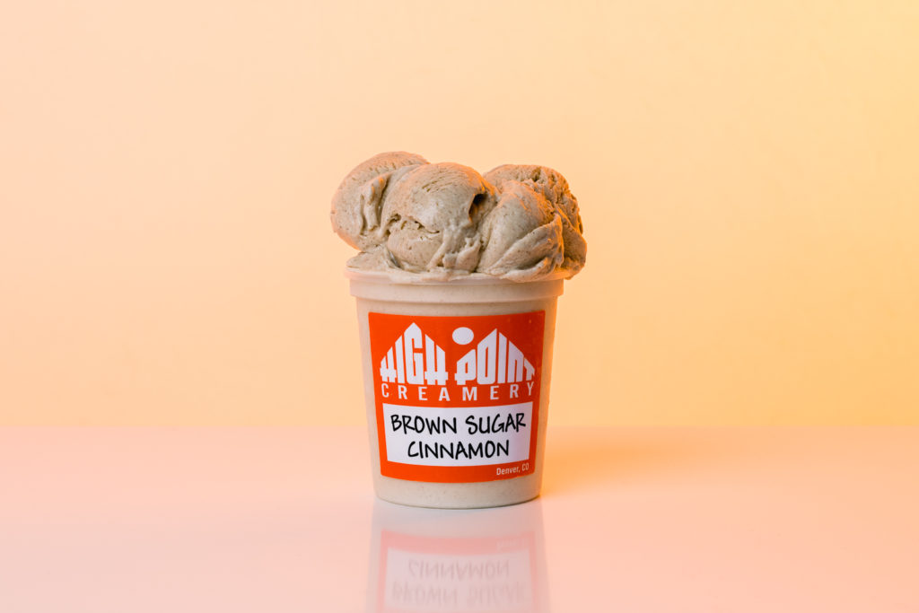 Product Photography | Open brown sugar cinnamon ice cream pint on orange background | High Point Creamery, Denver, Colorado