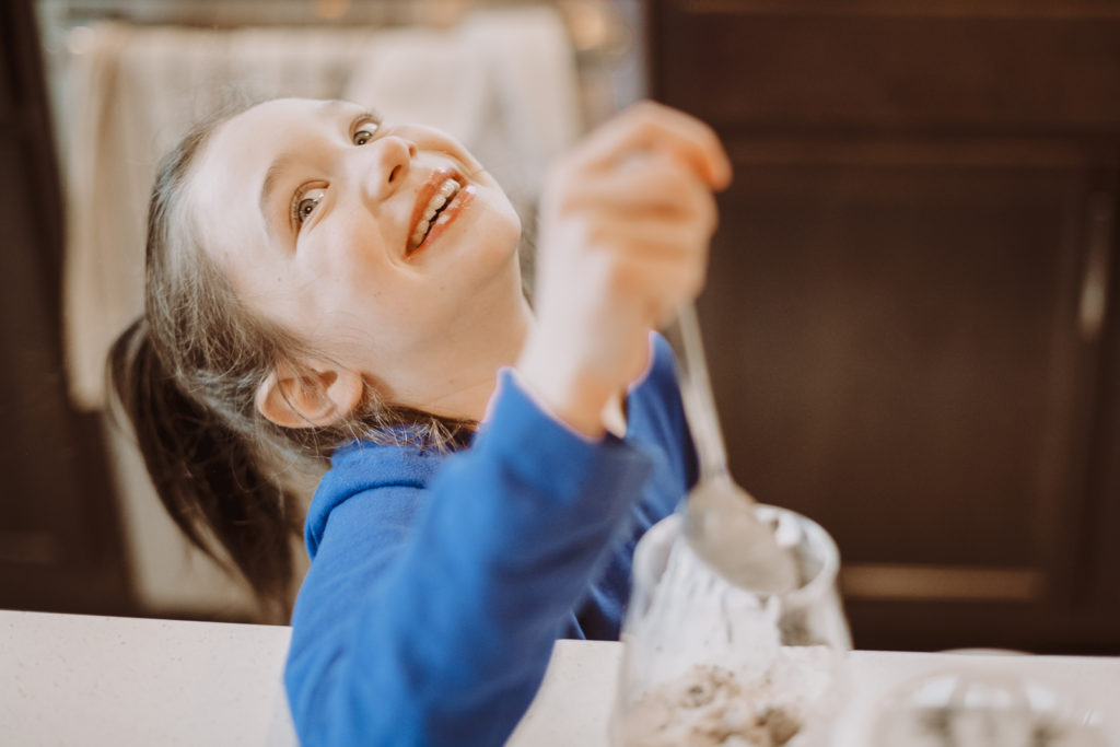 Product Photography | Girl smiling wildly as she scoops ice cream | High Point Creamery, Denver, Colorado