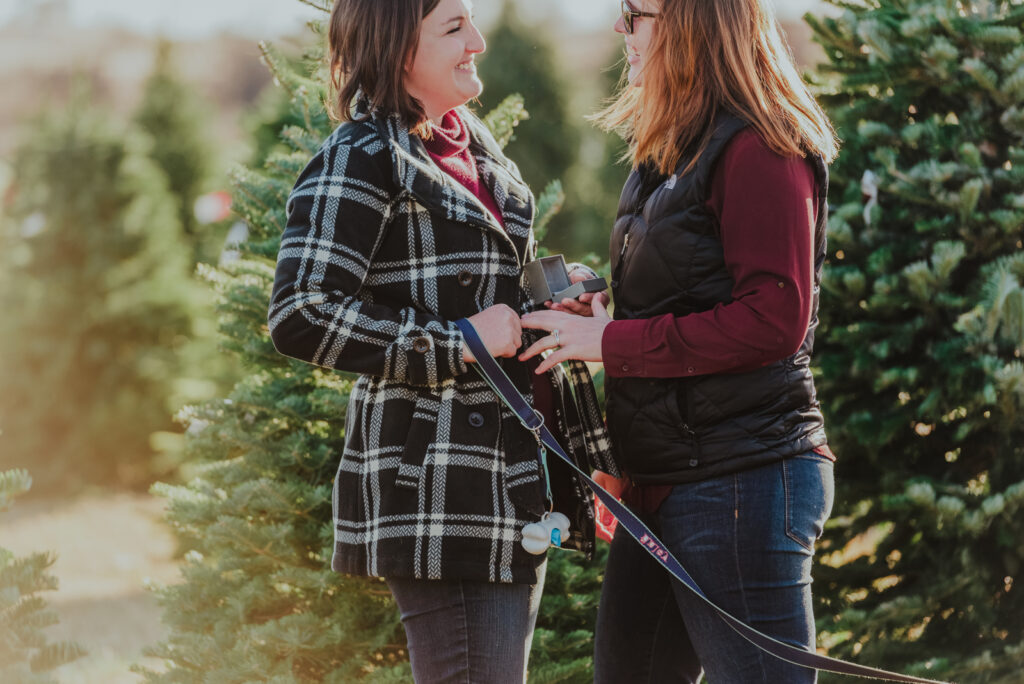 Pumpkin Patch Christmas Tree Farm outdoor holiday activity candid fun romantic engagement picture | From the Hip Photo Denver Colorado portrait photography