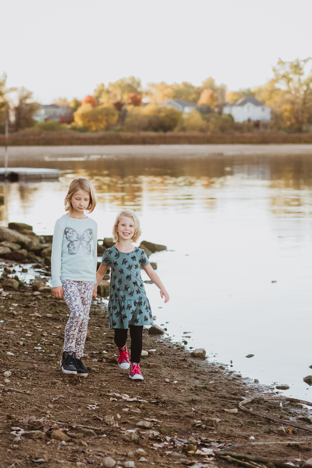 Vertical portrait in nature at Harper Lake showing woman among trees and landscape