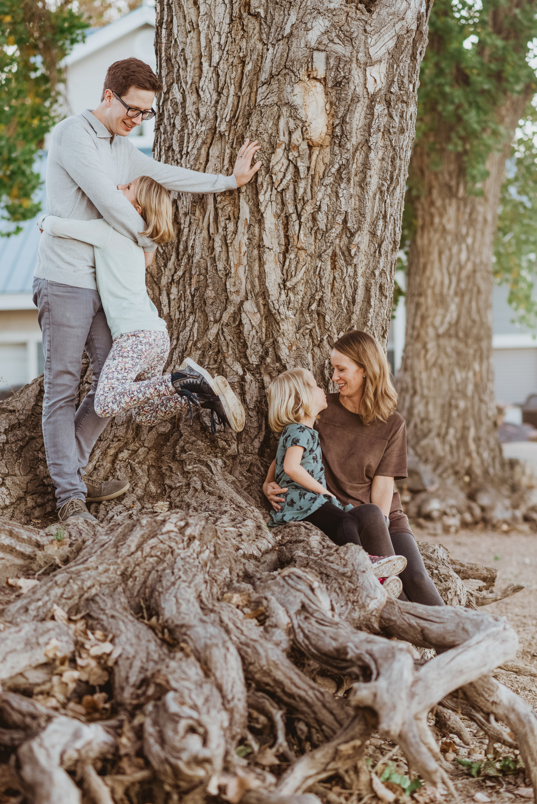 Vertical portrait of couple embracing at Harper Lake with scenic background