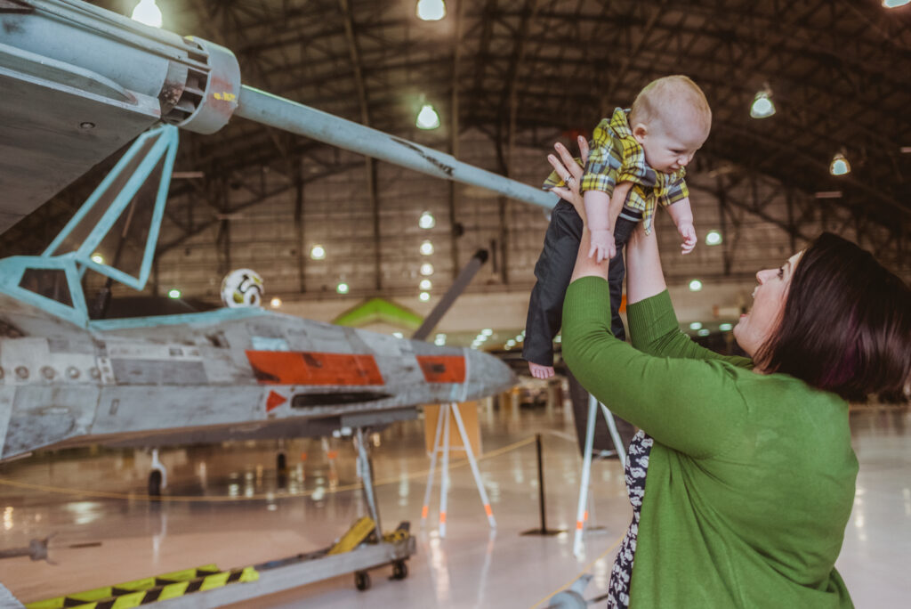 Wings Over The Rockies indoor aircraft museum edgy fun adventurous family picture | From the Hip Photo Denver Colorado portrait photography 