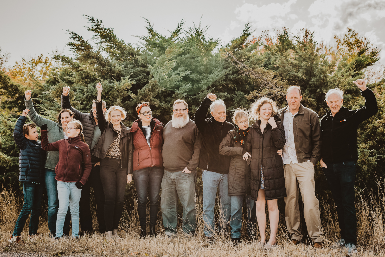 Family walking together on Harper Lake trail with scenic landscape backdrop