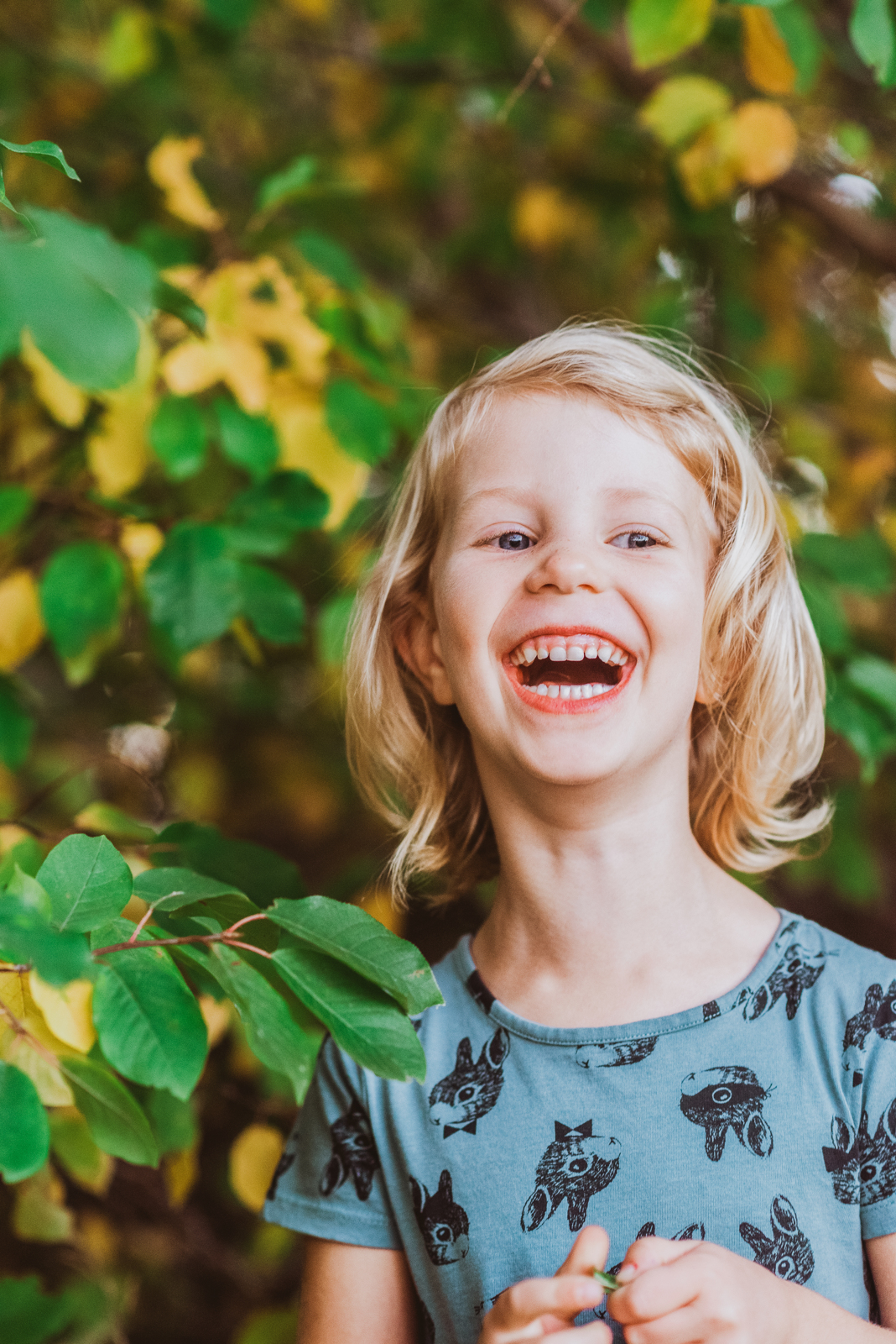 Vertical portrait of woman in nature at Harper Lake with lake in background