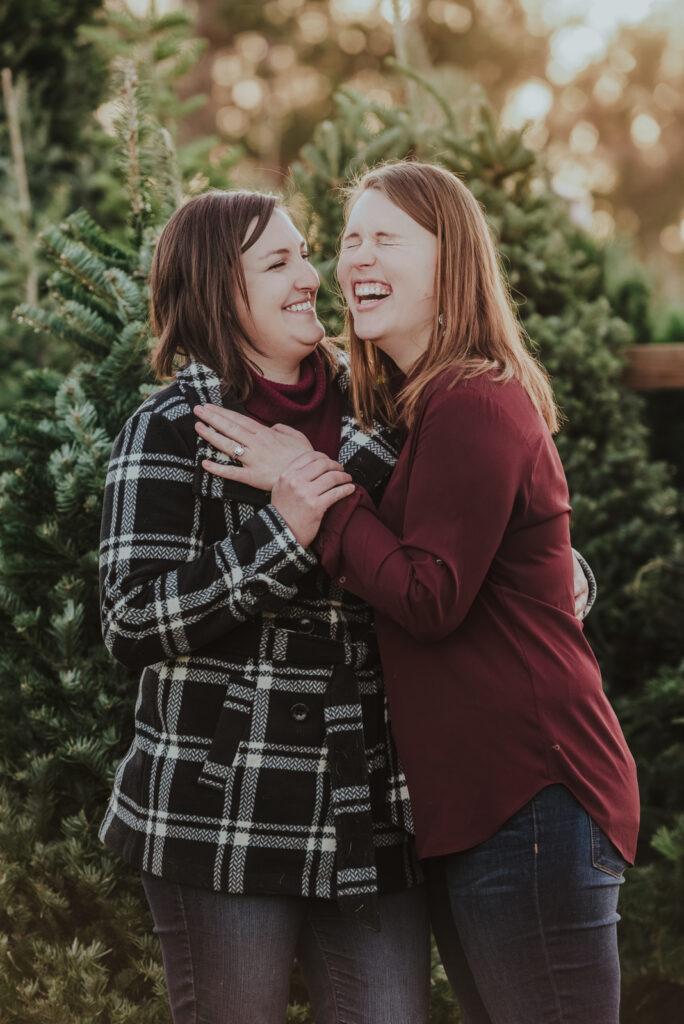 Pumpkin Patch Christmas Tree Farm outdoor holiday activity candid fun romantic engagement picture | From the Hip Photo Denver Colorado portrait photography
