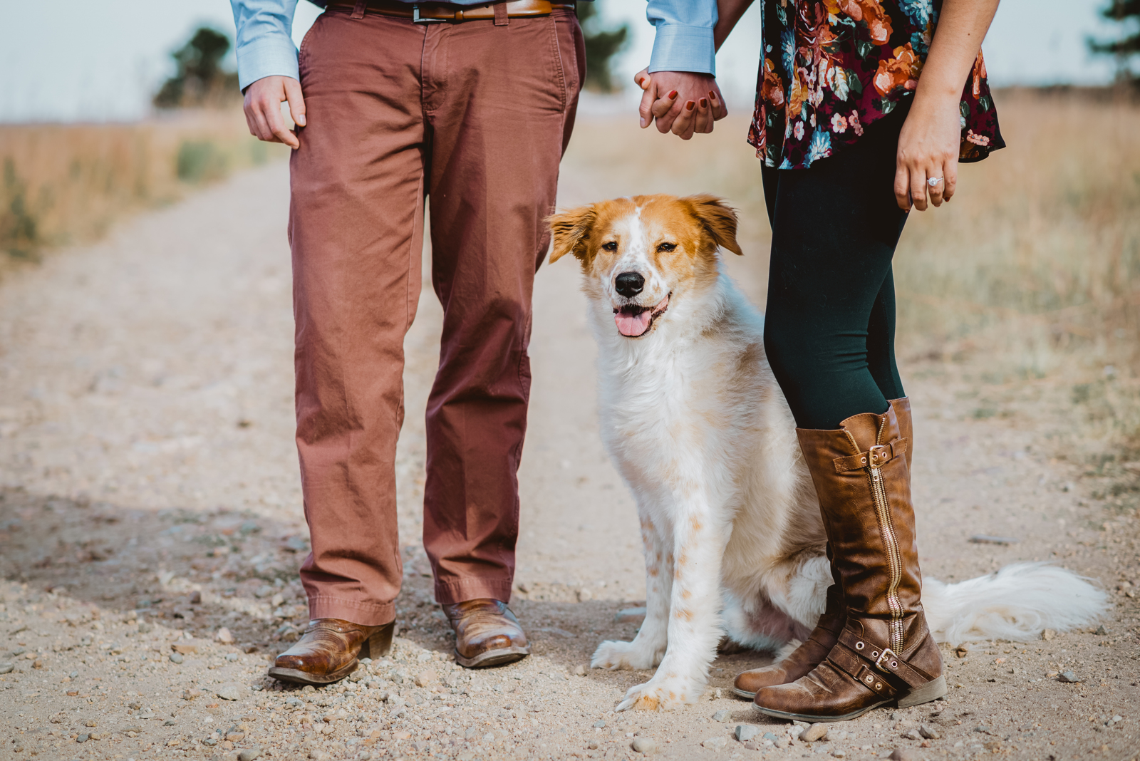 Sunset golden light illuminating engaged couple with mountain silhouette