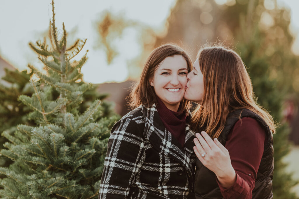 Pumpkin Patch Christmas Tree Farm outdoor holiday activity candid fun romantic engagement picture | From the Hip Photo Denver Colorado portrait photography