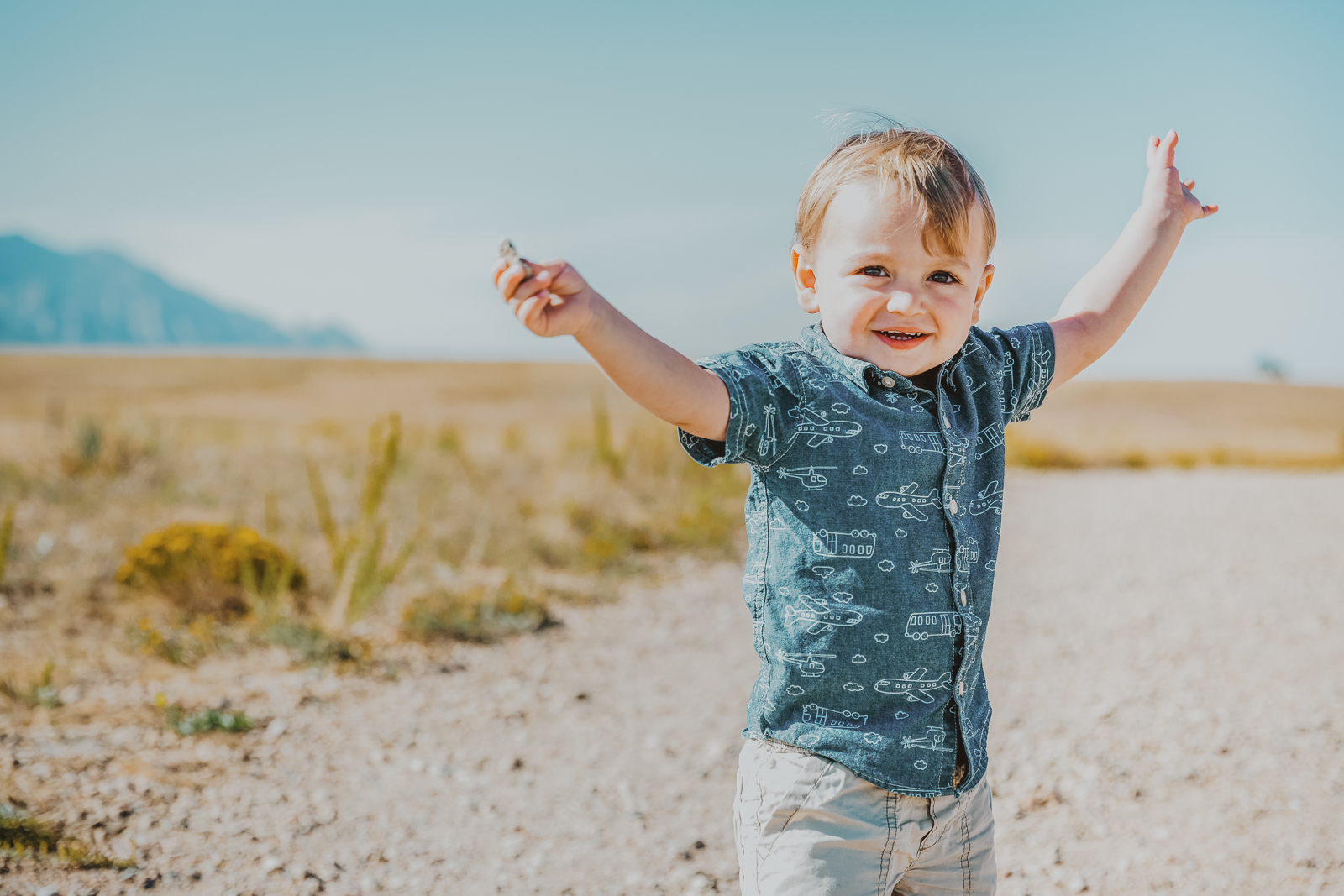 Couple walking trail with scenic landscape vistas in background