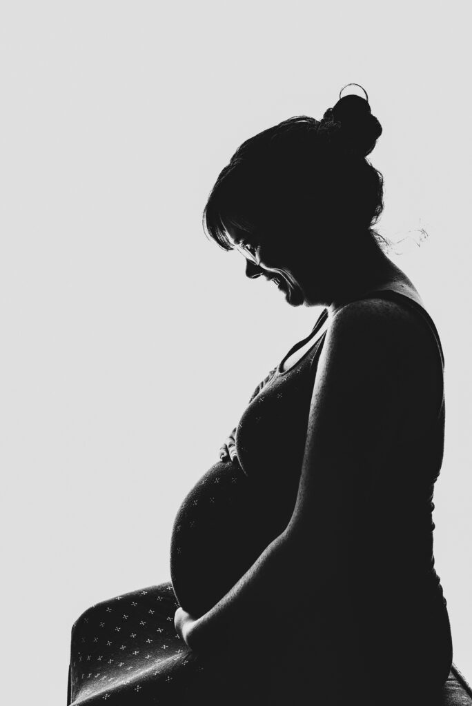 From the Hip Photo Studio indoor candid fun maternity family picture | From the Hip Photo Denver Colorado portrait photography