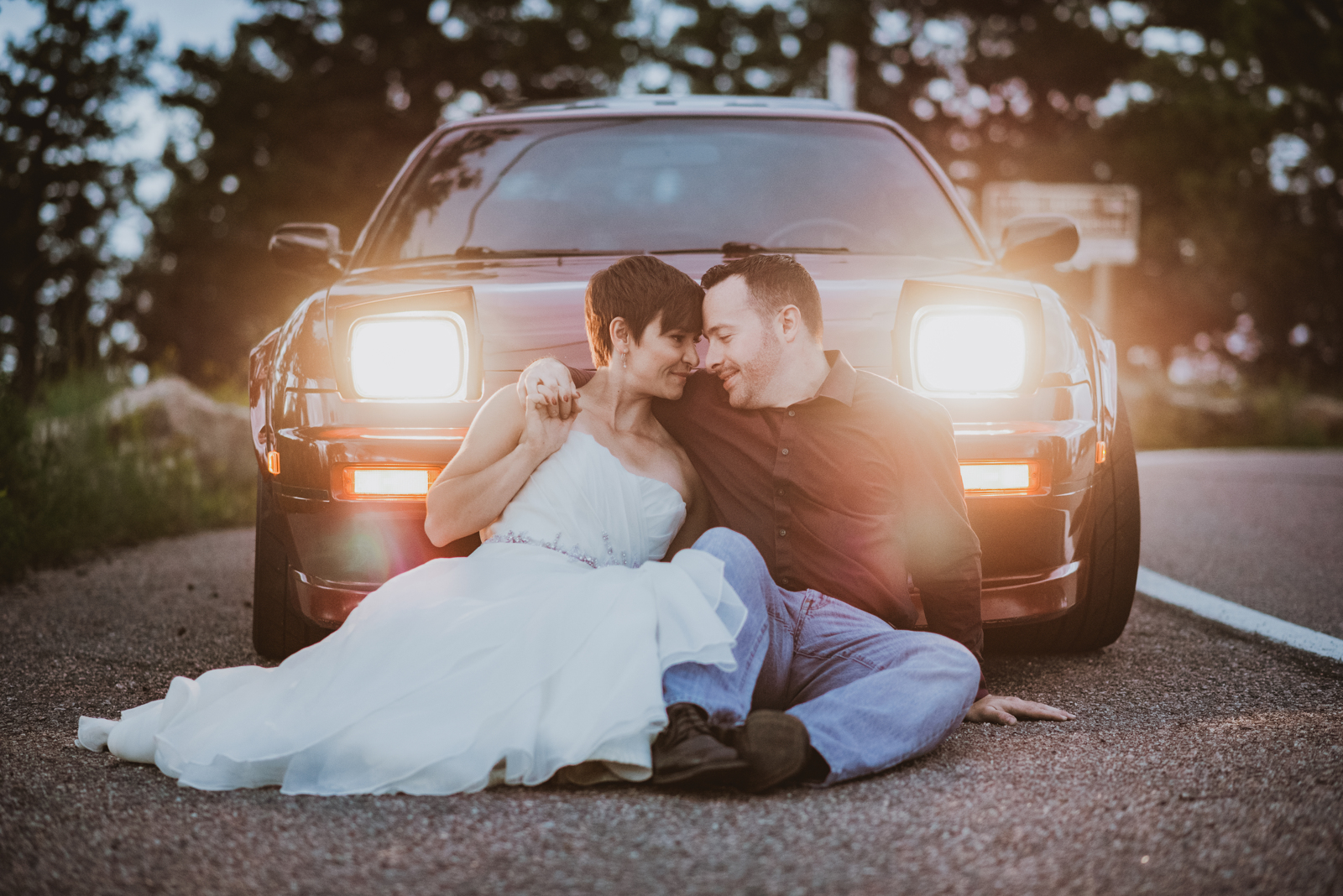 Engaged couple laughing and smiling during golden hour portrait session at Lookout Mountain overlook