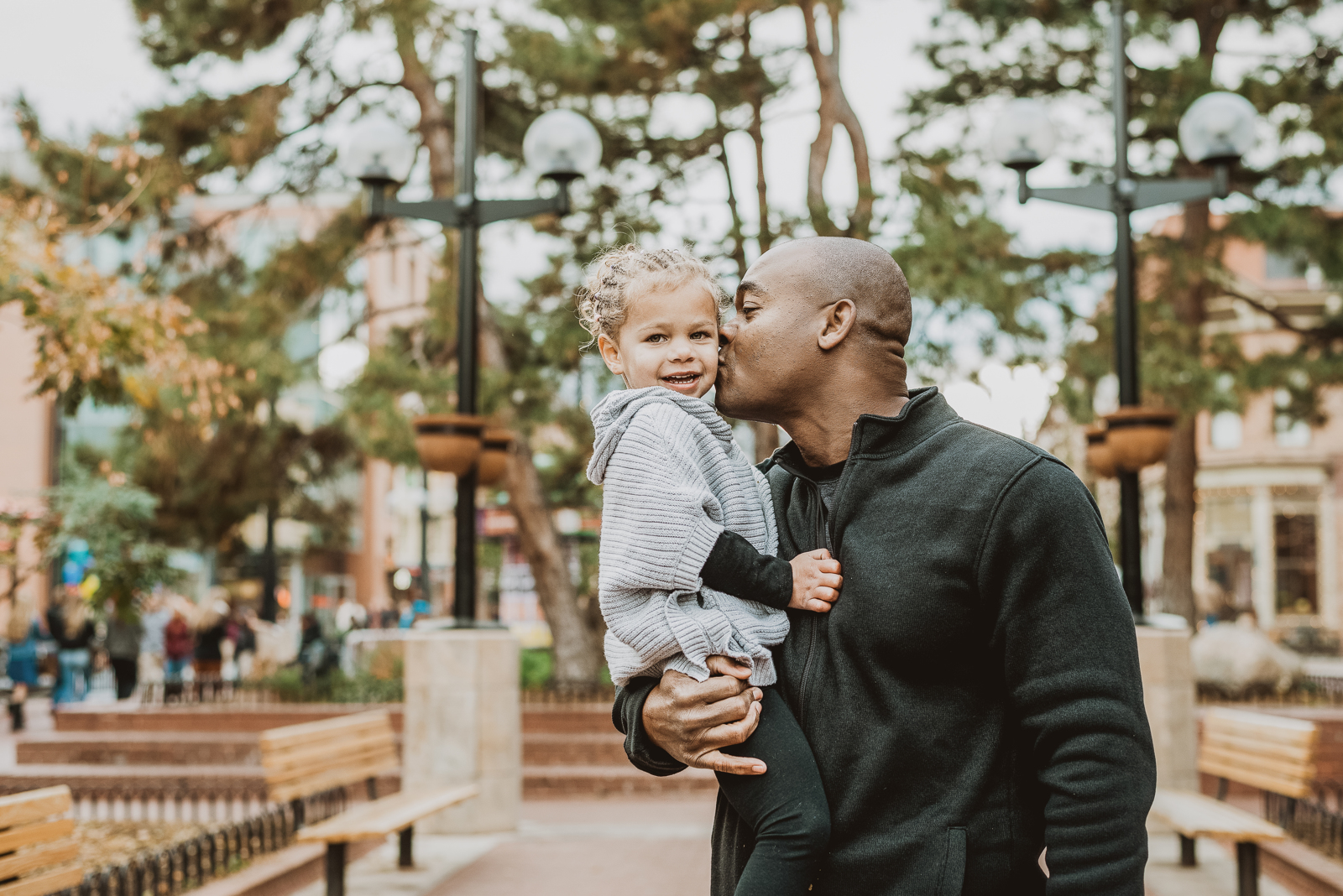 Outdoor portrait session on Boulder Pearl Street showing urban architecture and pedestrian mall