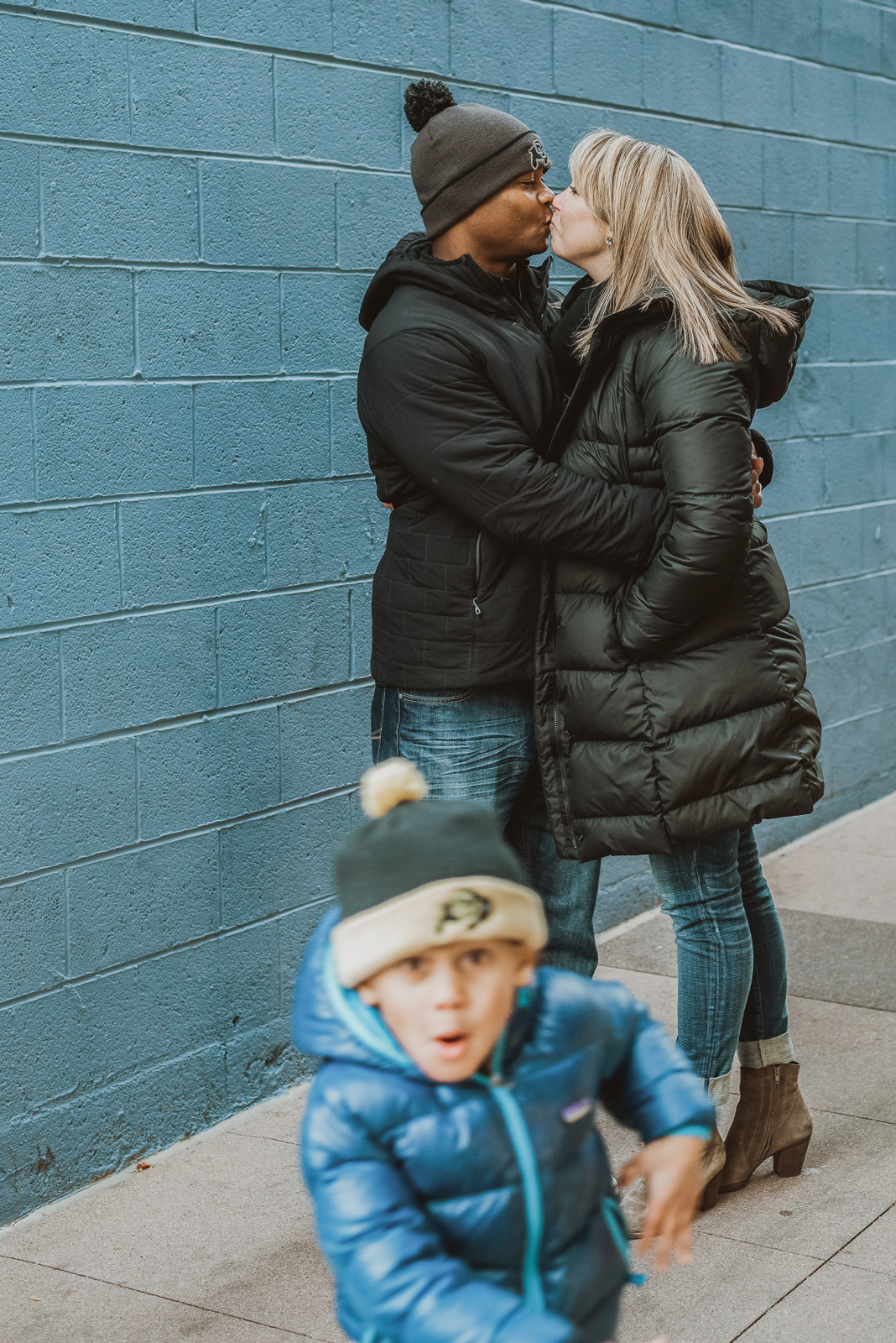 Vertical portrait of young woman at Pearl Street Boulder showcasing urban portrait photography