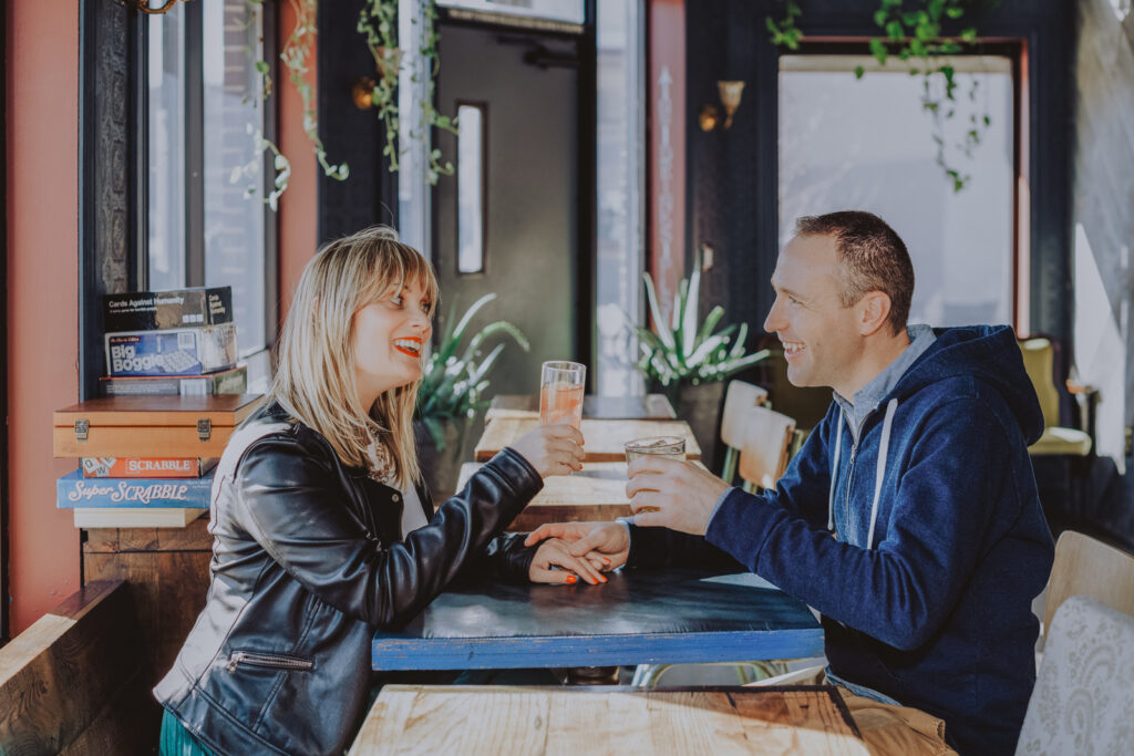 Your Favorite Spot restaurant bar coffee shop bookstore candid fun unique engagement picture | From the Hip Photo Denver Colorado portrait photography 