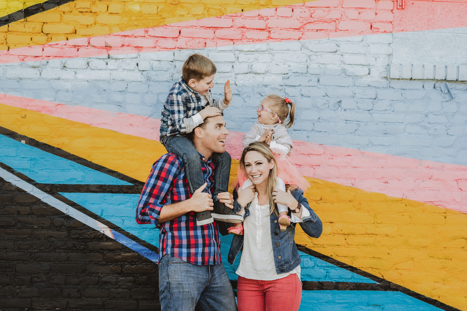 Family photography session in RiNo Art District Denver with street art murals