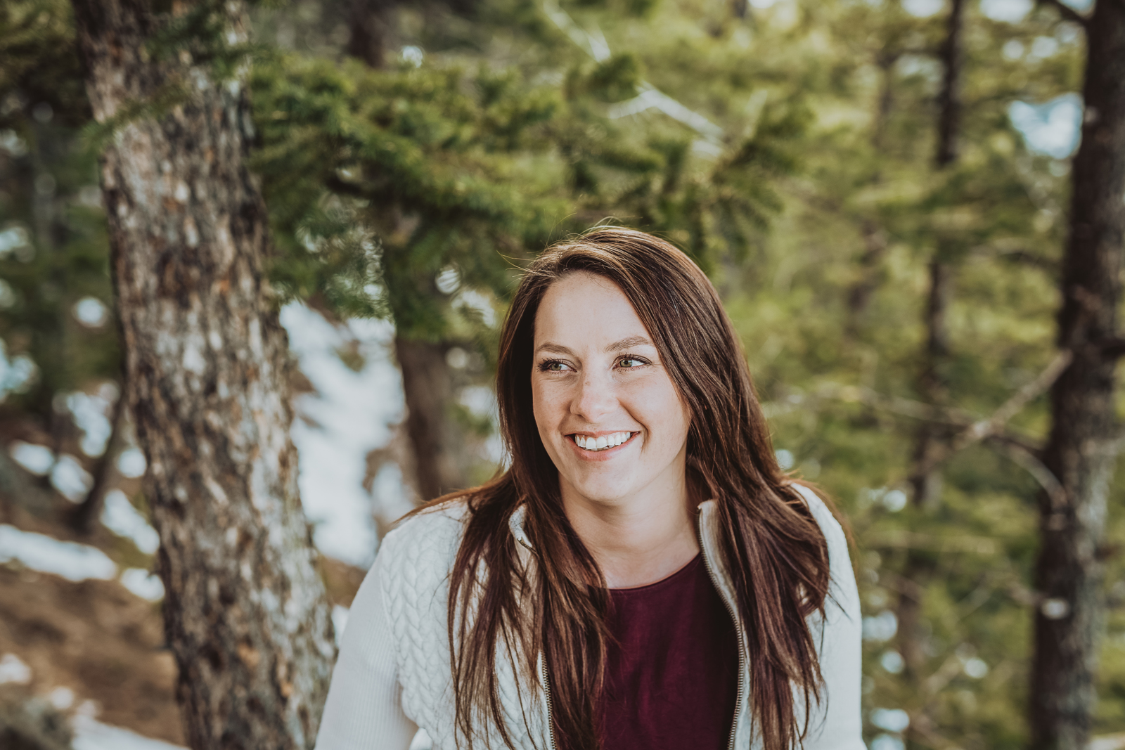 Male senior posing at scenic mountain overlook during professional senior portrait session