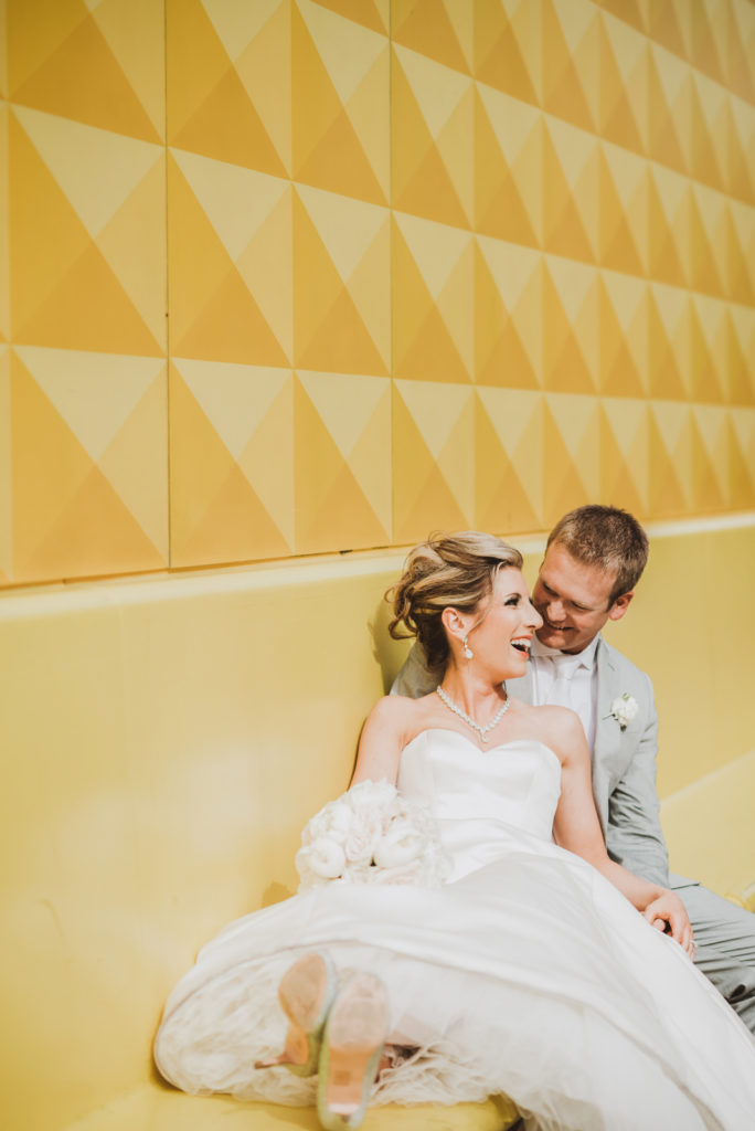 Downtown Denver Dairy Block outdoor urban fun candid loving wedding picture | From the Hip Photo Denver portrait photography 