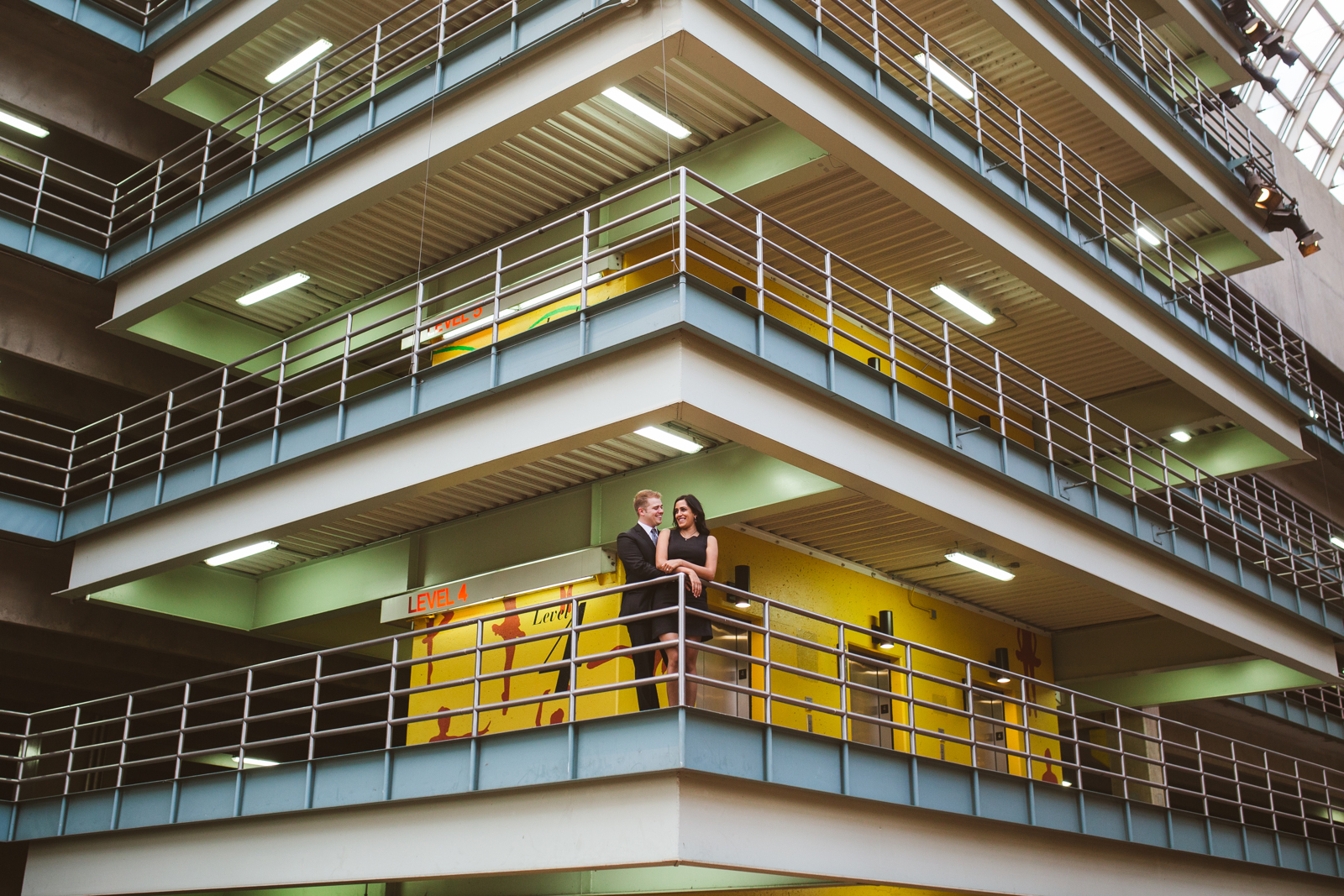 Modern downtown Denver engagement photos with city skyline backdrop