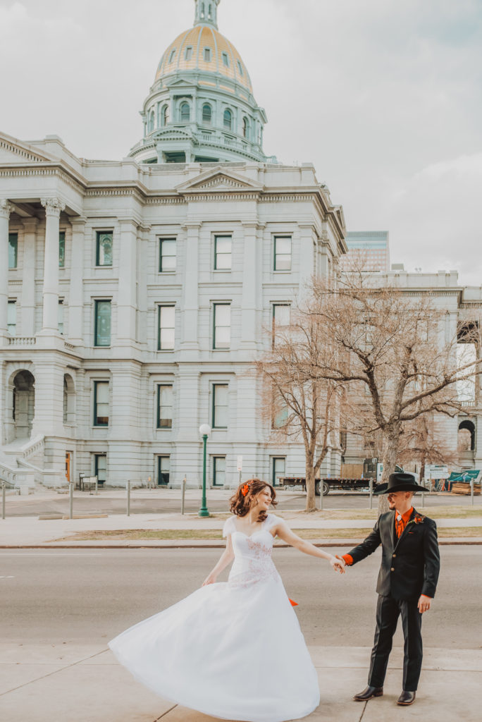 Downtown Denver Dairy Block outdoor urban fun candid loving wedding picture | From the Hip Photo Denver portrait photography 