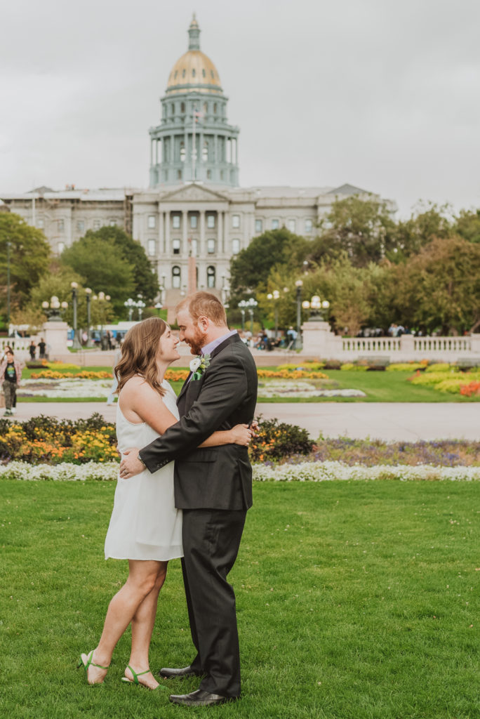 Downtown Denver Dairy Block outdoor urban fun candid loving wedding picture | From the Hip Photo Denver portrait photography 