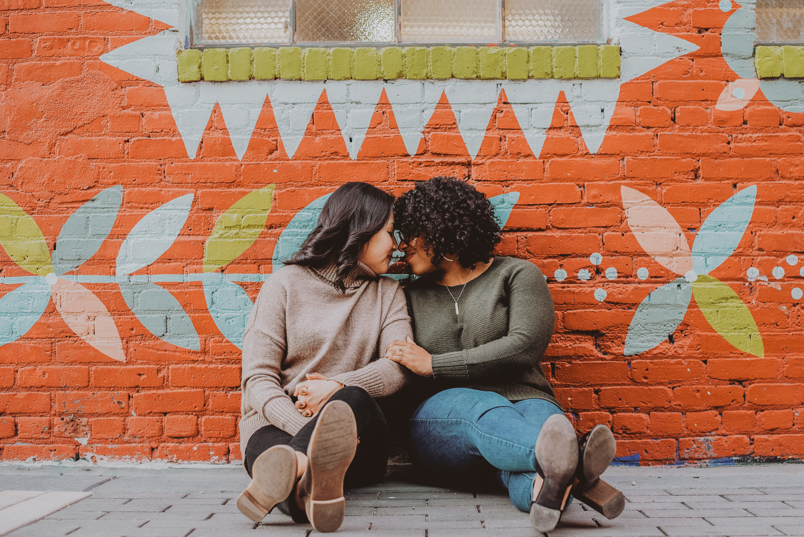 Senior portrait session in Denver RiNo Art District with colorful street murals in background