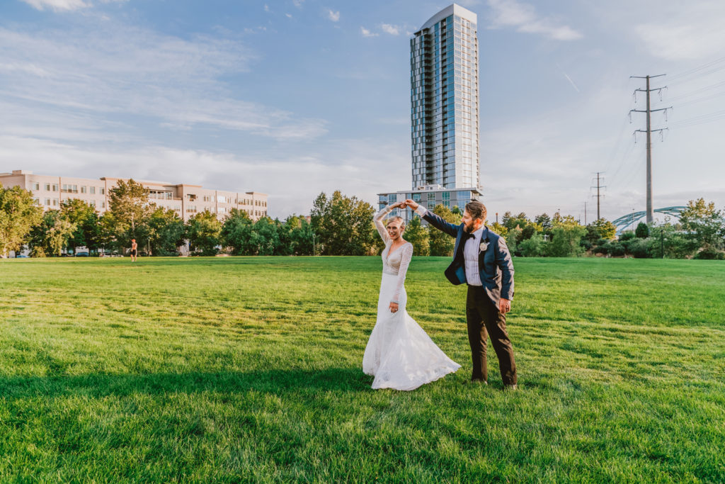 Downtown Denver Dairy Block outdoor urban fun candid loving wedding picture | From the Hip Photo Denver portrait photography 