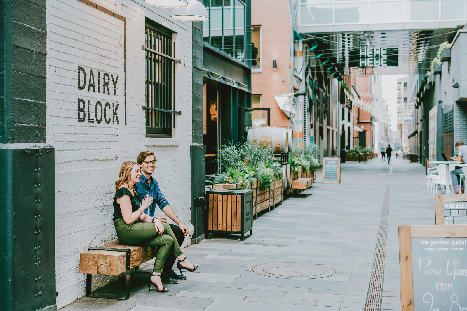 Stylish downtown Denver engagement photography with skyline views